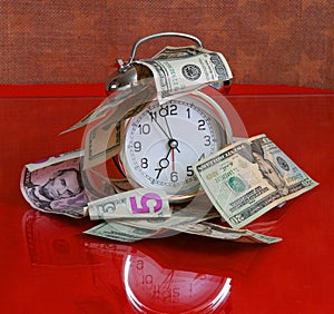 Time is money concept - clock and dollars