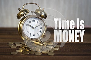 Time is money concept - golden alarm bell clock