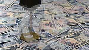 Time is money concept hourglass with dollars