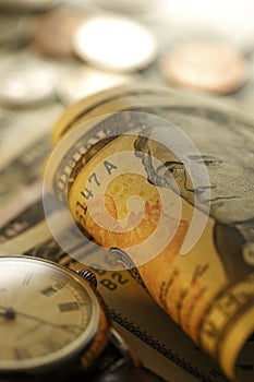 Time and Money. Gold Tone. Close up - Stock Image