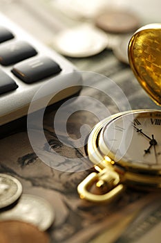 Time and Money. Gold Tone. Close up - Stock Image