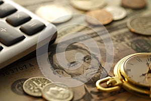 Time and Money. Gold Tone. Close up - Stock Image