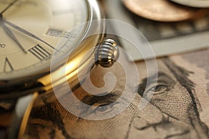 Time and Money. Gold Tone. Close up - Stock Image