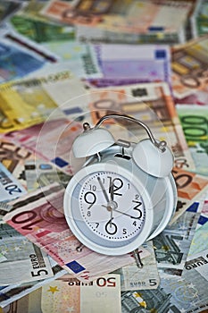 Time is Money with clock and Euro Bank notes