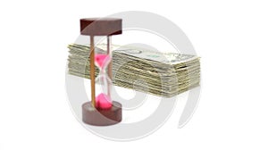 Time Is Money with Wood Sand Timer Blurred, Angled Money In Focus