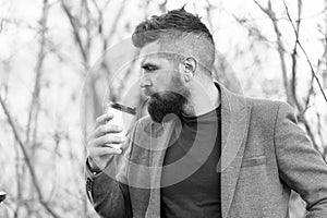 Time for myself. Hipster hold paper coffee cup. Relaxing coffee break. Businessman bearded guy drink coffee outdoors