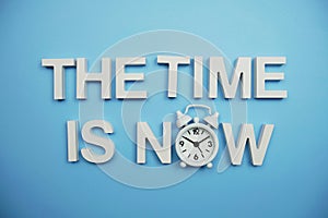 The Time is Now alphabet letters on blue background