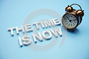 The Time is Now alphabet letters on blue background