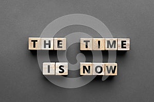 The time is now - words from wooden blocks with letters
