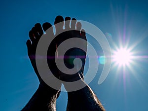 Time out on the beach Feet in the sun