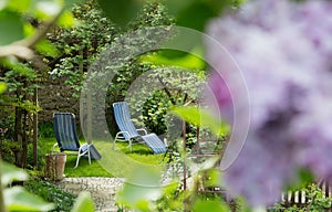 Time out in the garden - lounger chairs on the terrace.