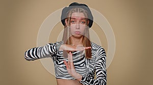 Time out, need a break, tired serious upset pretty young woman showing pause relax gesture, stop