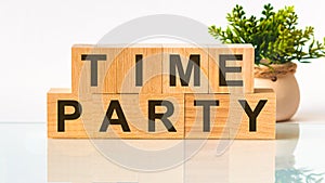 TIME PARTY word written on wood block. Faqs text on table, concept
