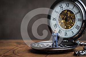 Time prove for business success concept, miniature people leader photo