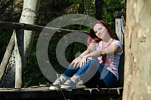 Time for relax , lady sitting on wooden bridge