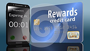 Time is running out on expiring credit card rewards and a time on a cell phone next to a card makes this point. photo