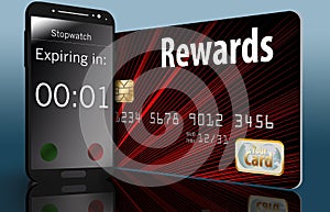 Time is running out on expiring credit card rewards and a time on a cell phone next to a card makes this point.