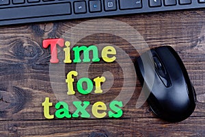Time for taxes words on table