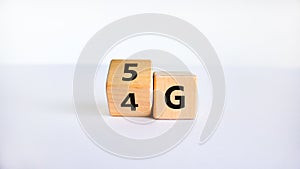 Time to 5G symbol. Turned a wooden cube and changes sign 4G to 5G. Technology, business, network, communication and 5G concept.