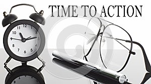 TIME TO ACTION text. Glasses and pencil and alarm clock