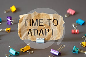 TIME TO ADAPT - inscription on paper