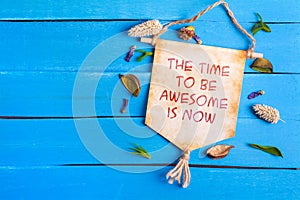 The time to be awesome is now text on Paper Scroll