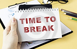 TIME TO BREAK text concept write on notebook.