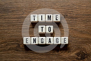 Time to Engage - word concept on building blocks, text