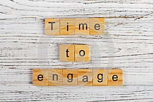 time to engage word made with wooden blocks concept