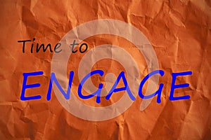 Time to Engage written on wrinkled orange paper