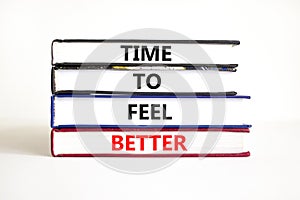 Time to feel better symbol. Concept words Time to feel better on books. Beautiful white table white background. Motivational