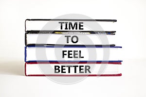 Time to feel better symbol. Concept words Time to feel better on books. Beautiful white table white background. Motivational