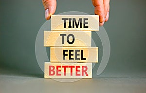 Time to feel better symbol. Concept words Time to feel better on wooden block. Beautiful grey table grey background. Businessman