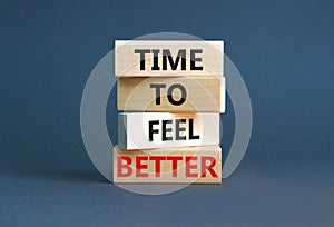 Time to feel better symbol. Concept words Time to feel better on wooden block. Beautiful grey table grey background. Motivational