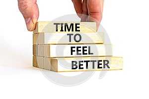 Time to feel better symbol. Concept words Time to feel better on wooden block. Beautiful white table white background. Businessman