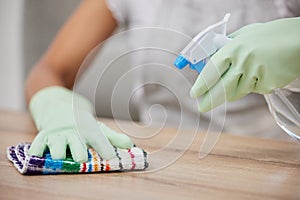 Time to get squeaky clean. an unrecognizable woman using a cloth and spray bottle to clean the surfaces at home.