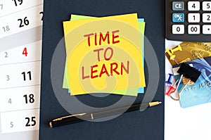 time to learn - text on yellow paper on blue background, concept