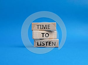 Time to listen symbol. Wooden blocks with words Time to listen. Beautiful blue background. Business and Active listening concept.