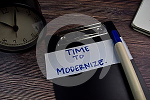 Time To Modernize write on sticky notes isolated on the table