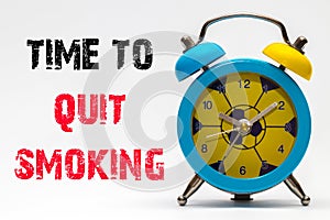 Time to Quit Smoking on a white background. Retro alarm clock