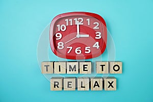 Time To Relax alphabet letter with alarm clock on blue background