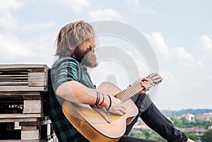 Time to relax. bearded man in checkered shirt sing song. music performer musician. musical string instrument. mature