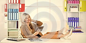 time to relax. woman with mobile phone in office. millennial girl browsing internet. attractive businesswoman using