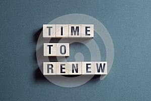 Time to renew - word concept on cubes