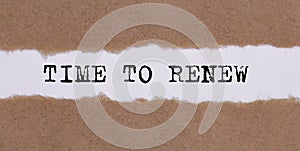 TIME TO RENEW written under torn paper on white background