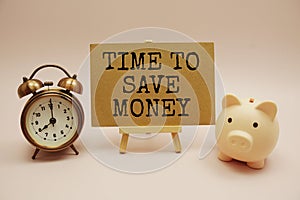 Time to save money text messege and piggy bank on pink background