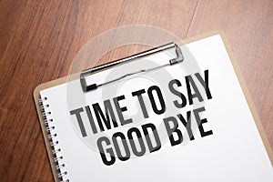 time to say good bye text on white paper on the wood table