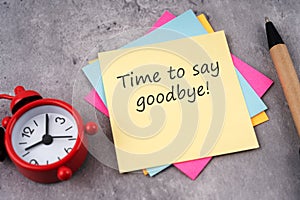 Time to say goodbye text on adhesive note