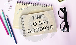 Time to Say Goodbye Text written on notebook page, red pencil on the right. Motivational