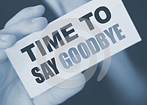 Time to Say Goodbye words on a card in hand of businessman. Business agreement termination concept